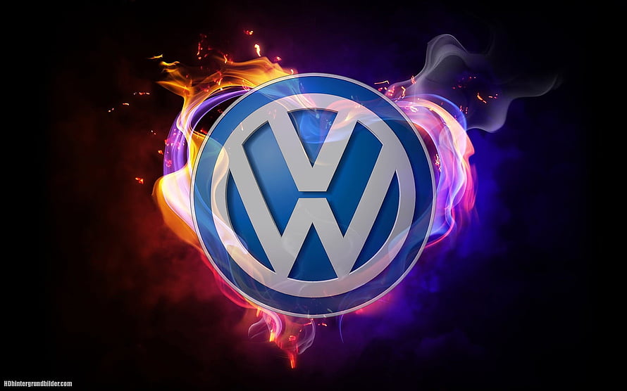 Volkswagen emblem surrounded by vibrant neon flames and swirling smoke on a dark background HD wallpaper
