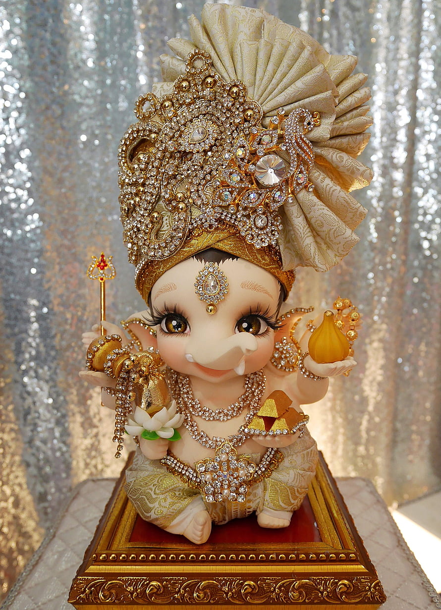 Adorned Baby Lord Ganesha Figurine with Gold Crown and Jewels HD phone wallpaper