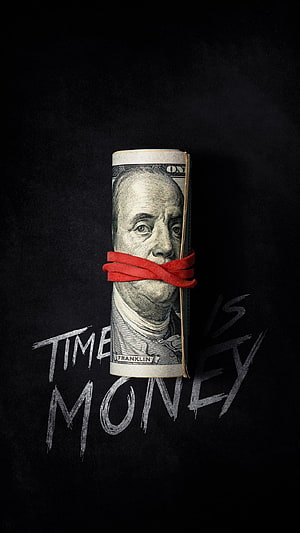 Rolled US Dollar Bill with Red Band and Time Is Money Text on Black Background HD phone wallpaper
