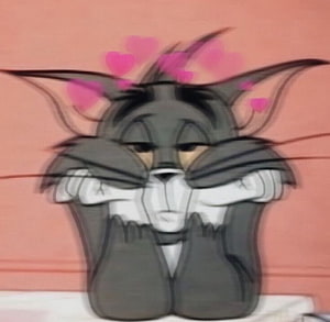 Tom from Tom and Jerry in a Blushing Vintage Cartoon Style with Floating Hearts HD wallpaper