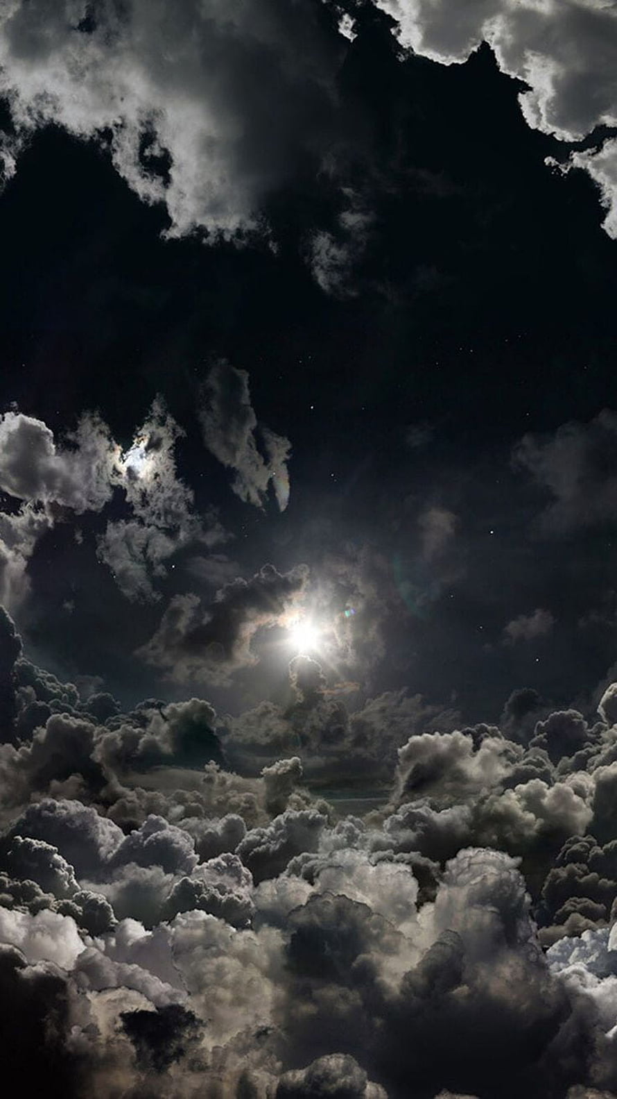 Dramatic Night Sky with Bright Moon Breaking Through Dark Storm Clouds HD phone wallpaper