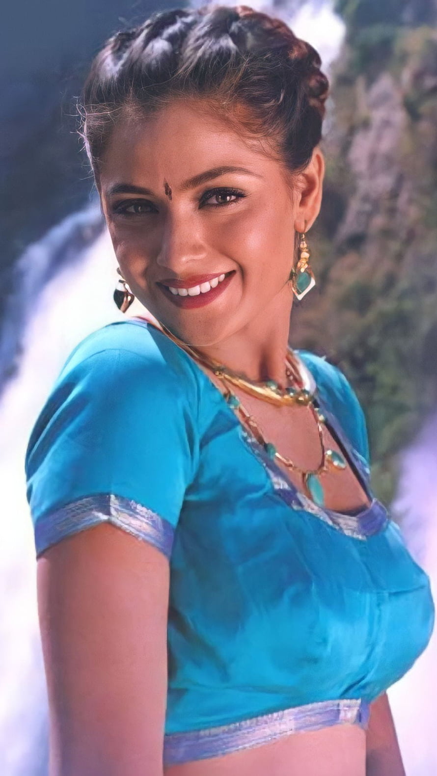 Simran in a Turquoise Blouse with Gold Jewelry and Waterfall Background HD phone wallpaper