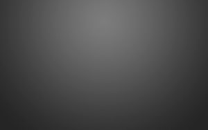 Minimalist Dark Grey Gradient Background with Soft Vignette and Subtle Texture HD wallpaper