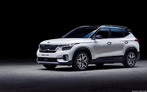 White Kia Seltos Compact SUV Studio Shot on Dark Background HD wallpaper