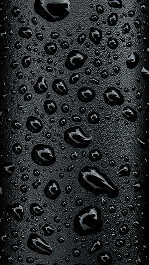 Macro Close-Up of Rain Droplets on a Dark Textured Surface HD phone wallpaper