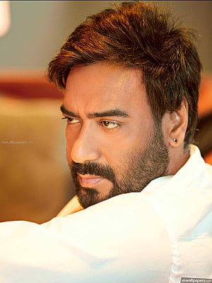 Ajay Devgan Close-Up Portrait in White Shirt with Warm Studio Lighting HD phone wallpaper