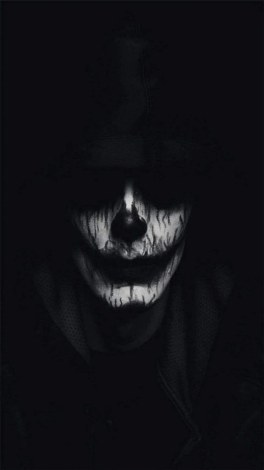Menacing Black and White Portrait of a Figure with Creepy Face Paint in Deep Shadow HD phone wallpaper
