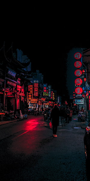 Neon-lit Chinese street at night with glowing red signs and pedestrians HD phone wallpaper