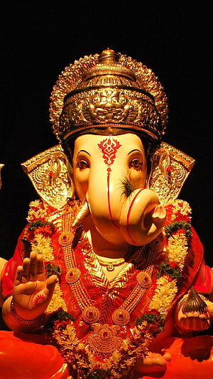 Ornate Ganesha Murti Adorned in Red Garments and Golden Crown HD phone wallpaper