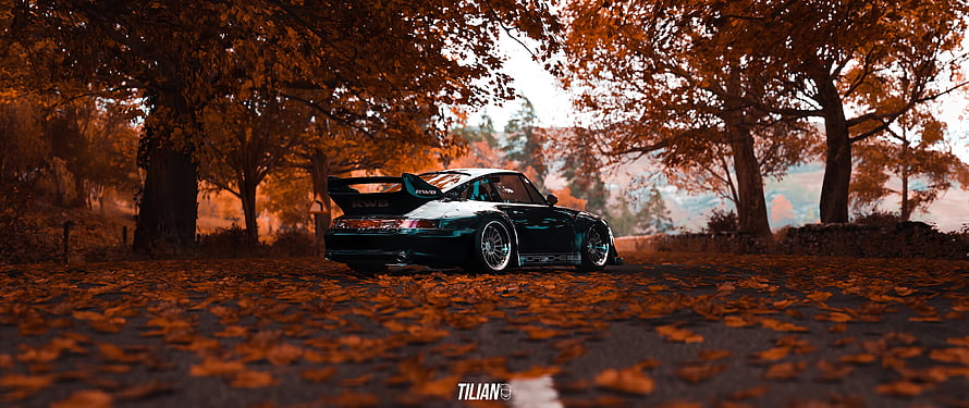 RWB Porsche 911 GT2 parked on a leaf-covered road in autumn HD wallpaper