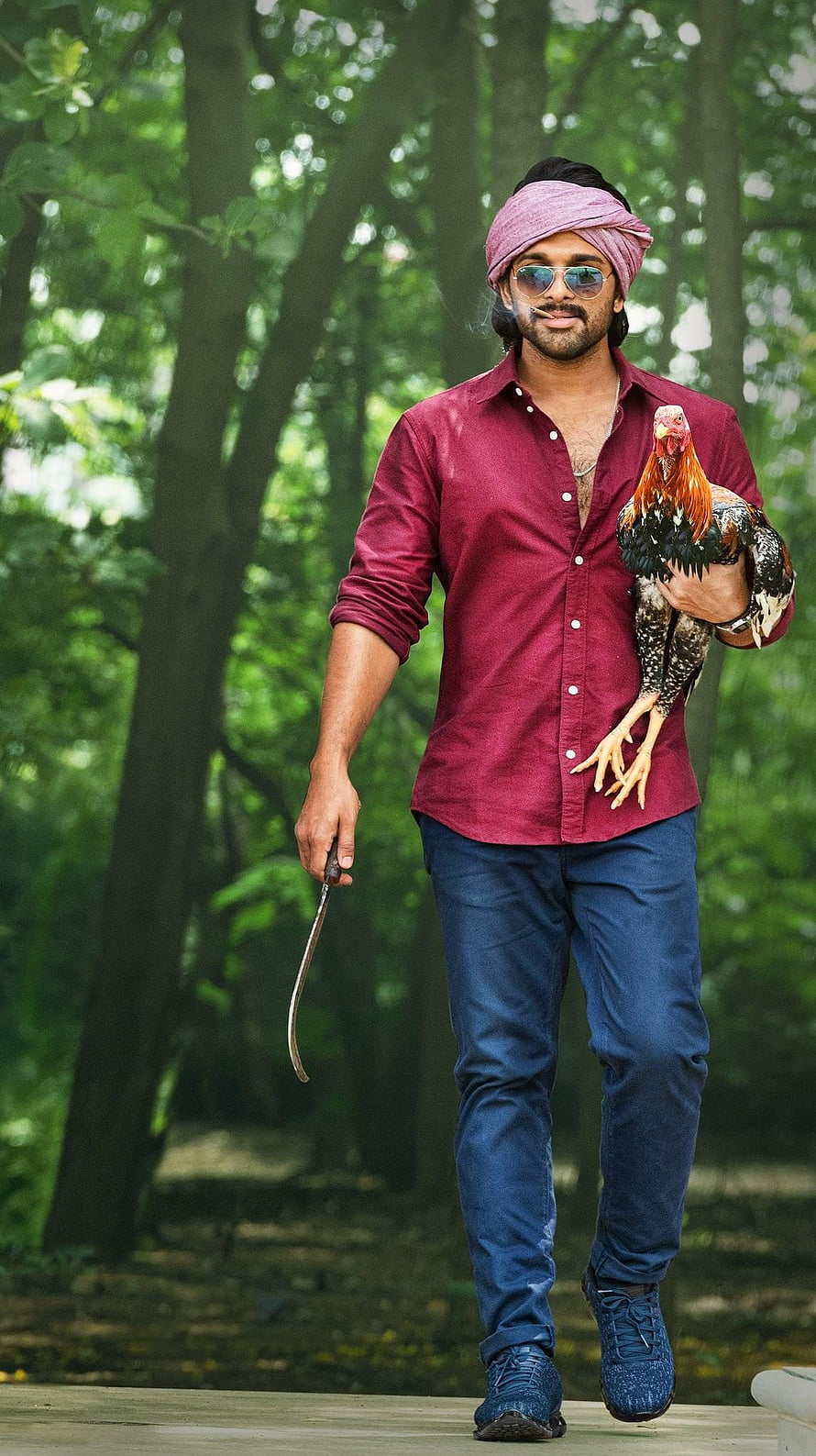 Allu Arjun in Ala Vaikuntapurram Lo with rooster and curved blade in forest setting HD phone wallpaper