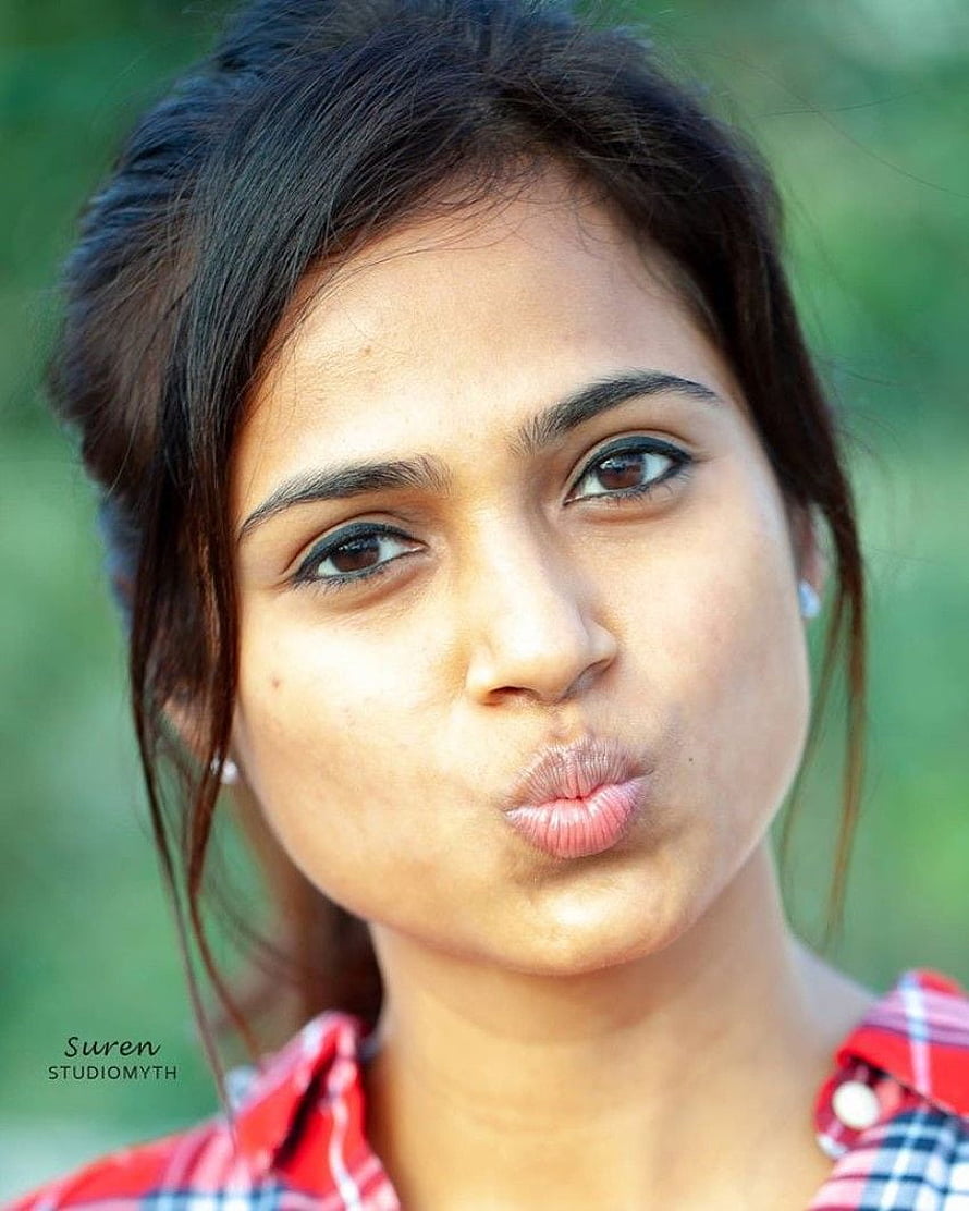 Ramya Pandian Portrait in Red Plaid Shirt with Playful Expression HD phone wallpaper