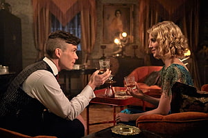 Tommy Shelby and Grace in an intimate period drama scene from Peaky Blinders HD wallpaper