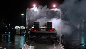 DeLorean Time Machine Emerging from Trailer in Back to the Future HD wallpaper