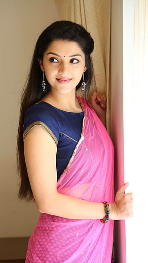 Mehreen Kaur Pirzada in a vibrant pink saree with navy blue blouse and traditional jewelry HD phone wallpaper