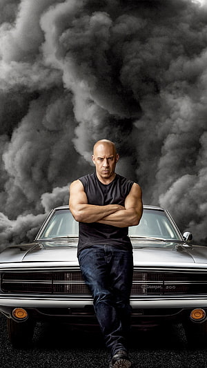 Vin Diesel in Fast and Furious 9 Leaning on Classic Muscle Car with Dramatic Smoke Background HD phone wallpaper