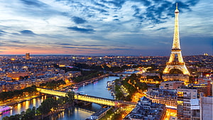 Eiffel Tower and Seine River at Dusk with City Lights in Paris HD wallpaper