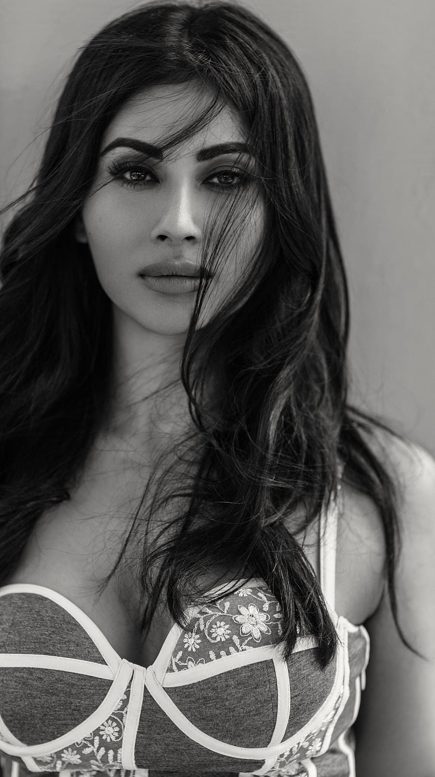 Mouni Roy Black and White Portrait with Flowing Hair and Lace Corset HD phone wallpaper