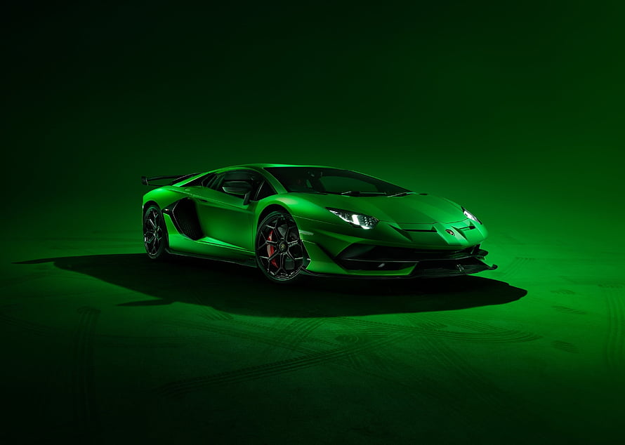 Lamborghini Aventador SVJ in Vibrant Green Against Dark Studio Background HD wallpaper