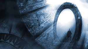 Stargate SG-1 Ancient Alien Portal With Glowing Light And Lone Figure HD wallpaper