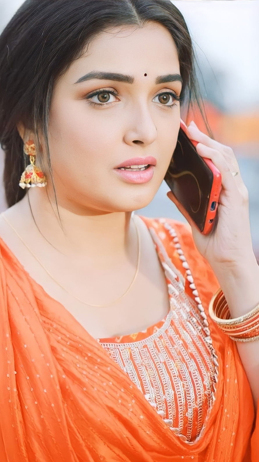 Amrapalli Dubey in Orange Saree Talking on Mobile Phone HD phone wallpaper