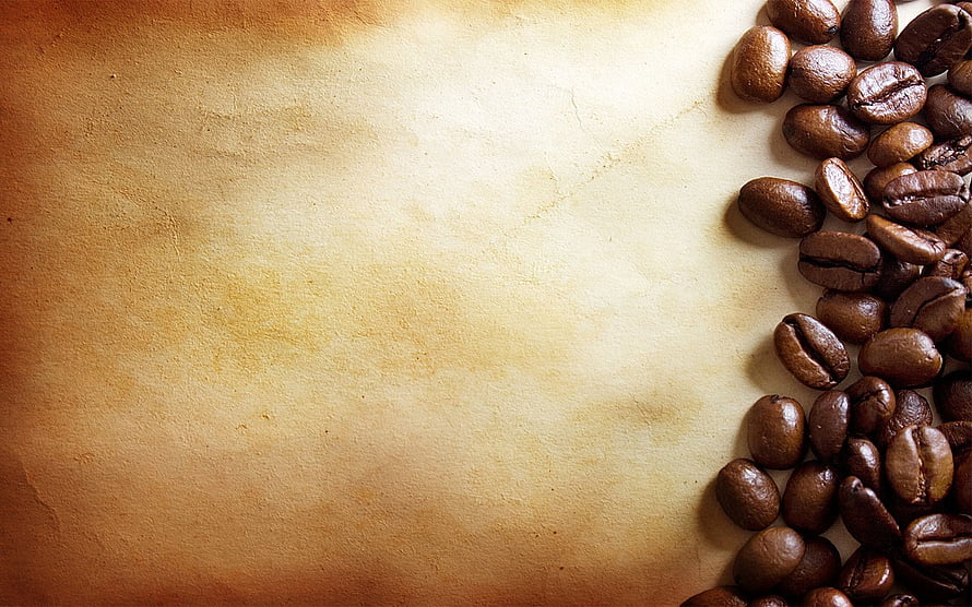 Roasted Coffee Beans on Textured Parchment Paper with Warm Vintage Background HD wallpaper