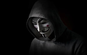 Anonymous Guy Fawkes Mask in Dark Hoodie Against Black Background HD wallpaper