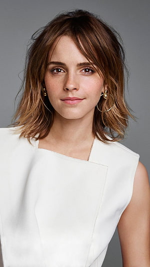 Emma Watson Studio Portrait in White Sleeveless Top with Gold Hoop Earrings HD phone wallpaper