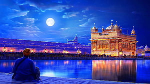 Golden Temple at Night in Amritsar with Full Moon and Reflecting Pool HD wallpaper