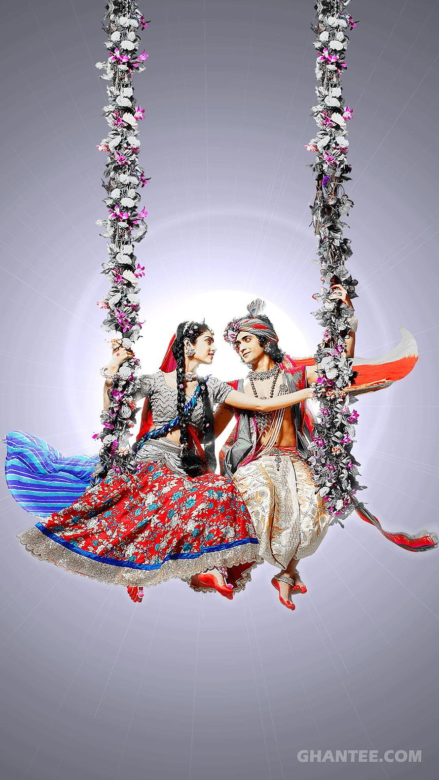 Radha Krishna on a Flower-Adorned Swing in Traditional Indian Attire HD phone wallpaper