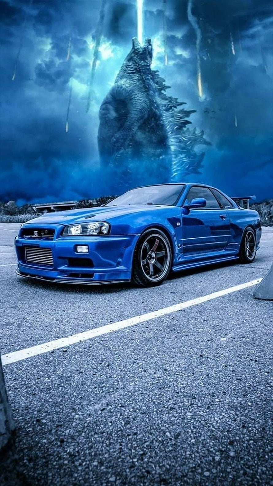 Blue Nissan Skyline R34 GT-T Coupe Parked Before a Giant Godzilla Silhouette Under a Stormy Sky HD phone wallpaper