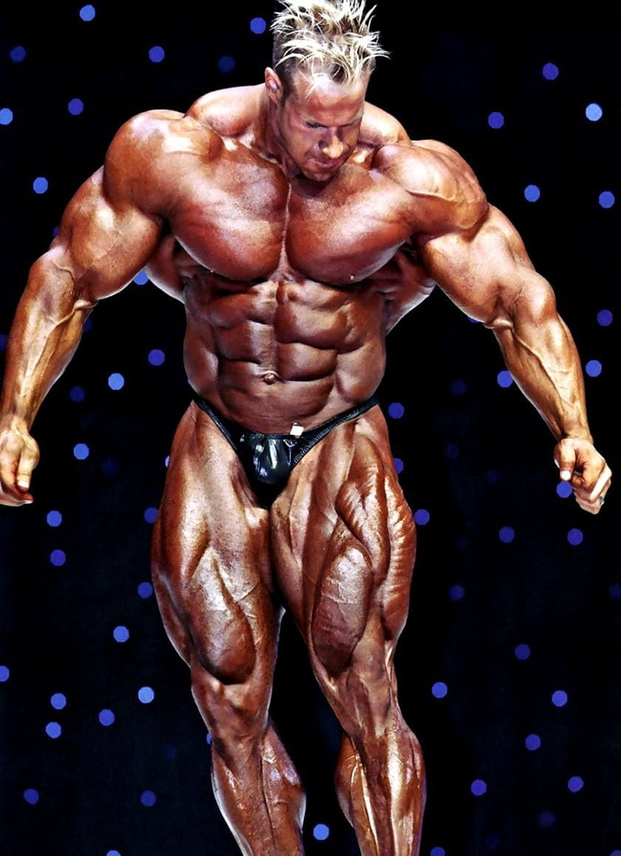 Jay Cutler Bodybuilding Stage Pose with Intense Muscle Definition and Dramatic Lighting HD phone wallpaper