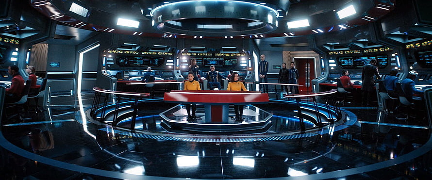 Star Trek Enterprise Bridge Interior with Crew in Uniforms and Futuristic Control Panels HD wallpaper