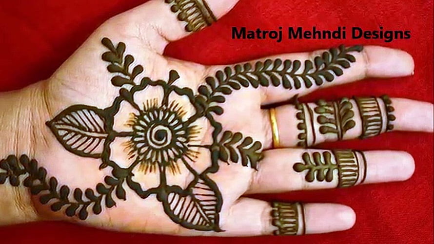 Intricate Floral Henna Hand Art with Leaf Patterns and Central Mandala HD wallpaper