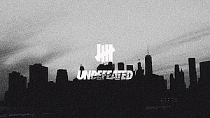 Undefeated Brand Logo Over Grayscale Chicago Skyline Silhouette HD wallpaper