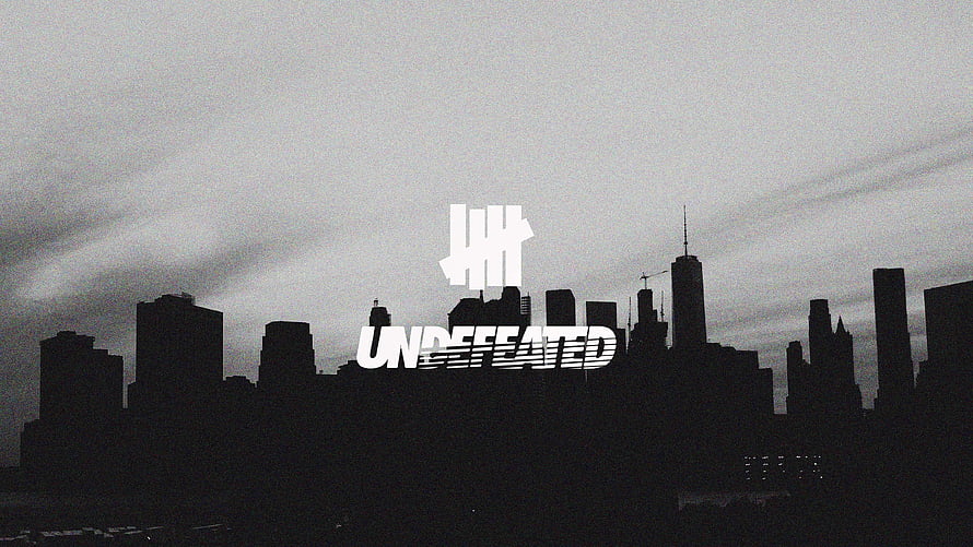 Undefeated Brand Logo Over Grayscale Chicago Skyline Silhouette HD wallpaper