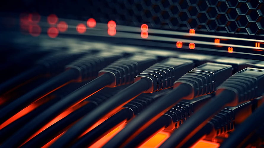 Close-up of network cables plugged into a server rack with glowing red indicator lights HD wallpaper