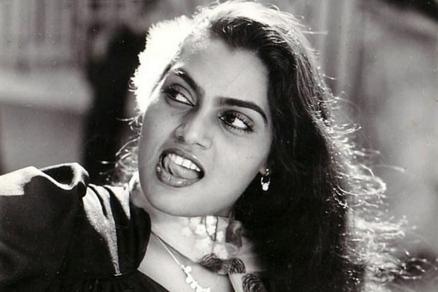 Silk Smitha Black and White Portrait with Intense Expression and Flowing Hair HD wallpaper