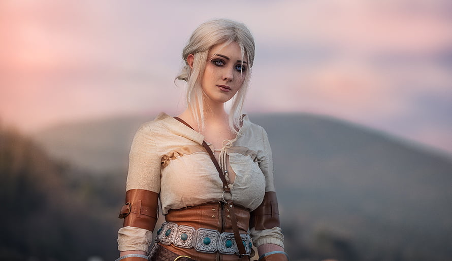 Ciri from The Witcher in a rustic medieval outfit with a detailed leather belt and ornate buckle HD wallpaper