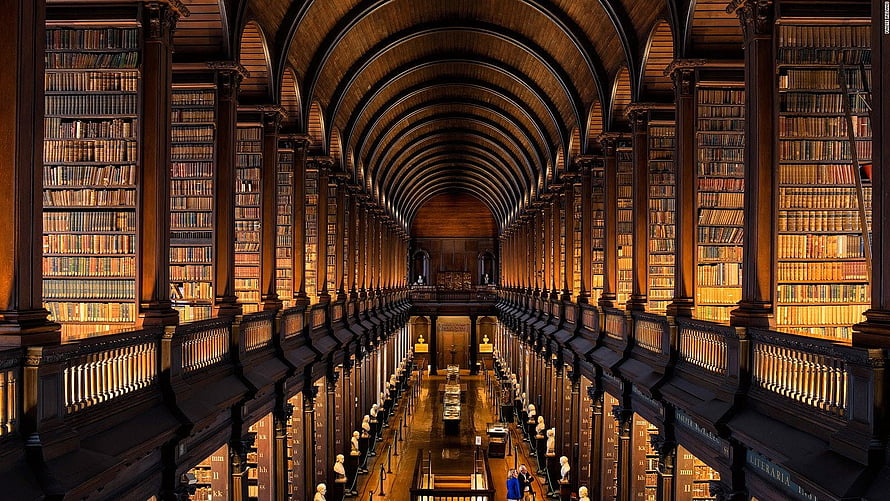 Grand Gothic Library Interior With Vaulted Wooden Ceiling And Tall Bookshelves HD wallpaper