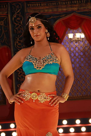 Varalakshmi Sarathkumar in teal and orange belly dance costume with gold jewelry HD phone wallpaper