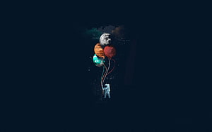 Astronaut Floating in Deep Space Holding a Cluster of Colorful Planet Balloons HD wallpaper