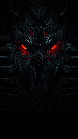 Optimus Prime Dark Metallic Face with Glowing Red Eyes in Cinematic Shadow HD phone wallpaper