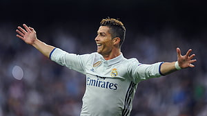 Cristiano Ronaldo celebrating in Real Madrid white home kit with arms wide open on the pitch HD wallpaper