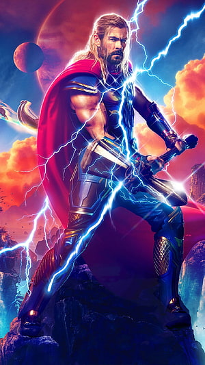 Thor from Love and Thunder wielding Mjolnir with lightning and red cape on a rocky cliff HD phone wallpaper