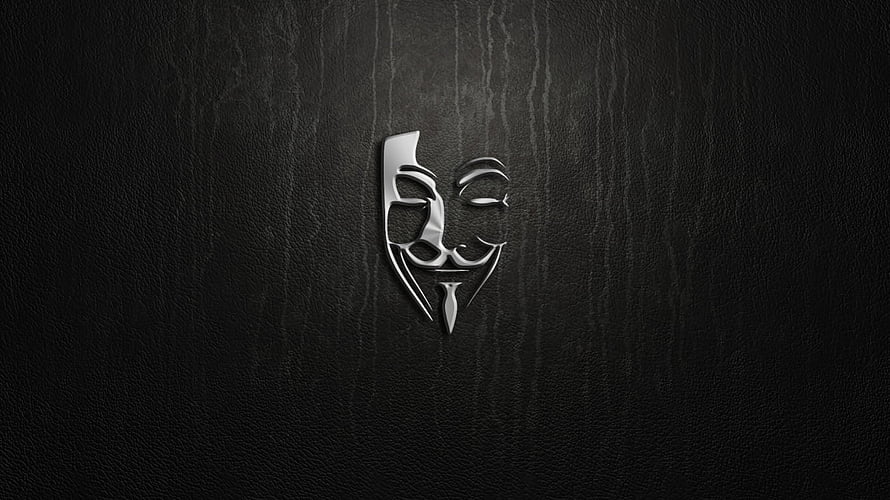 Stylized Guy Fawkes Mask Emblem on Dark Textured Background HD wallpaper