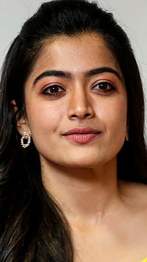 Rashmika Mandanna Close-Up Portrait With Dark Hair And Diamond Hoop Earrings HD phone wallpaper