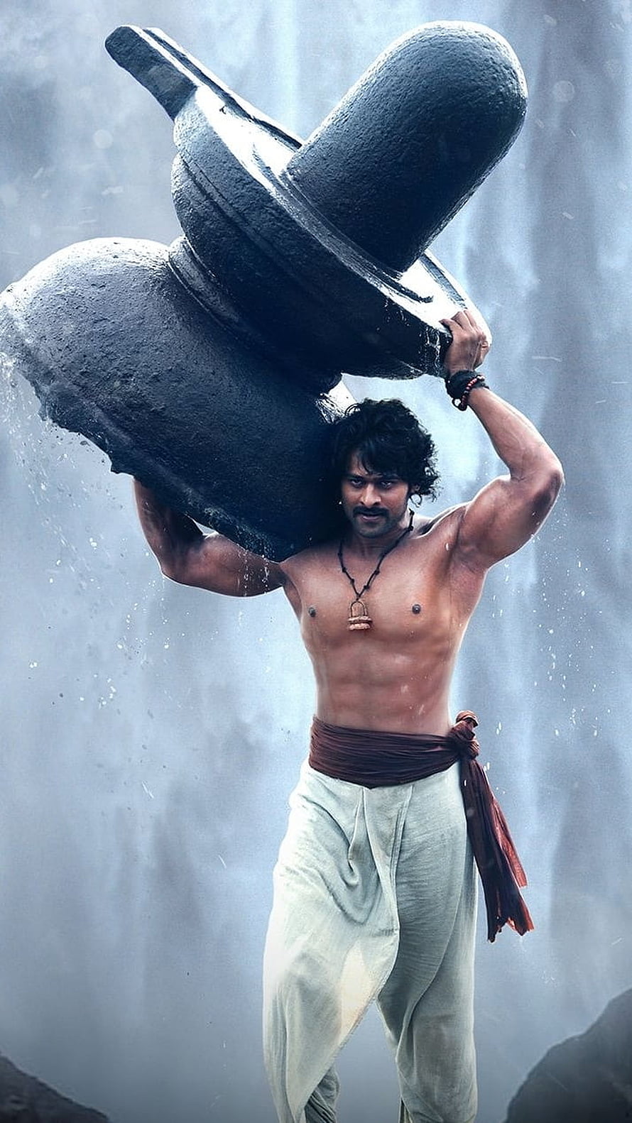 Prabhas Carrying Massive Stone Shiv Ling in Cinematic Action Scene HD phone wallpaper