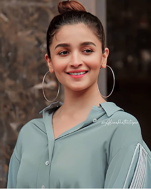 Alia Bhatt in a sage green blouse with large hoop earrings and a high bun hairstyle HD phone wallpaper