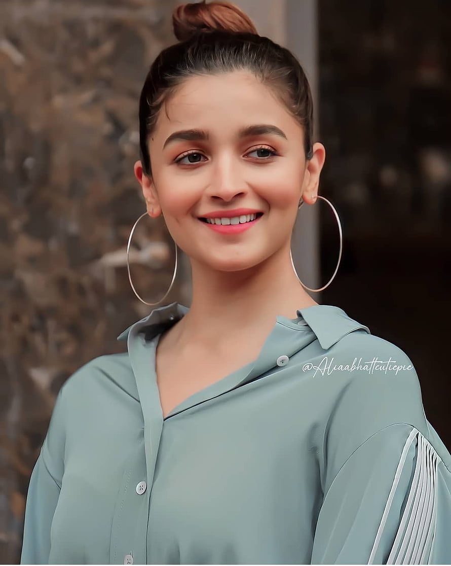 Alia Bhatt in a sage green blouse with large hoop earrings and a high bun hairstyle HD phone wallpaper